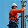 Technician working on a mobile network tower